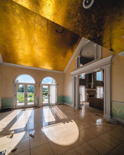 abandoned room with gold leaf ceiling