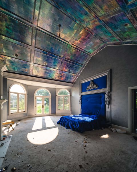 abandoned master bedroom with irridescent ceiling