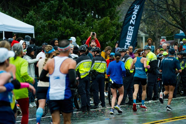 boston police block a group of fans at the 2023 boston marathon