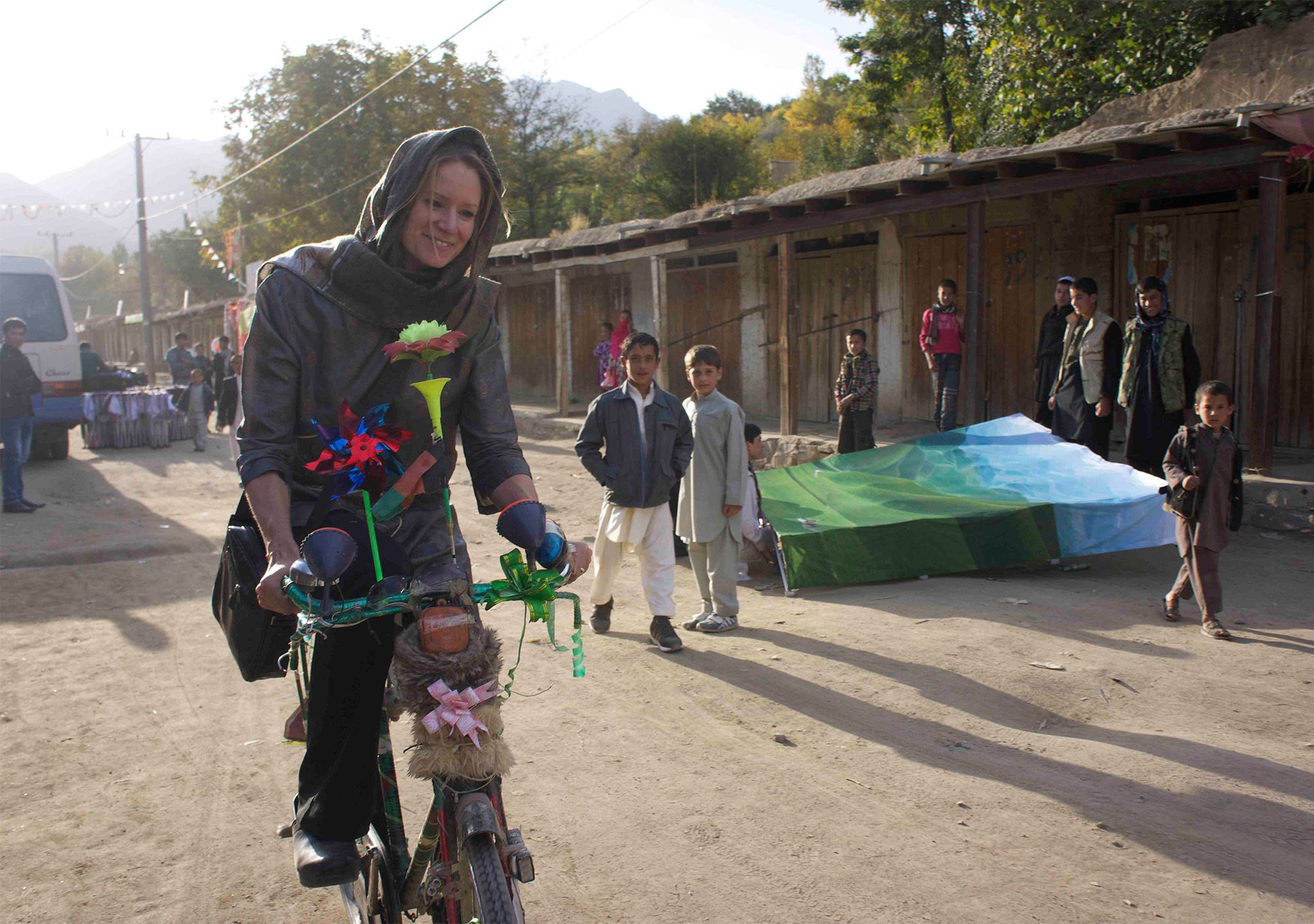 Galpin rides a borrowed bike in Istalif, Afghanistan, in 2012.