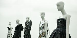 a group of mannequins wearing black and white