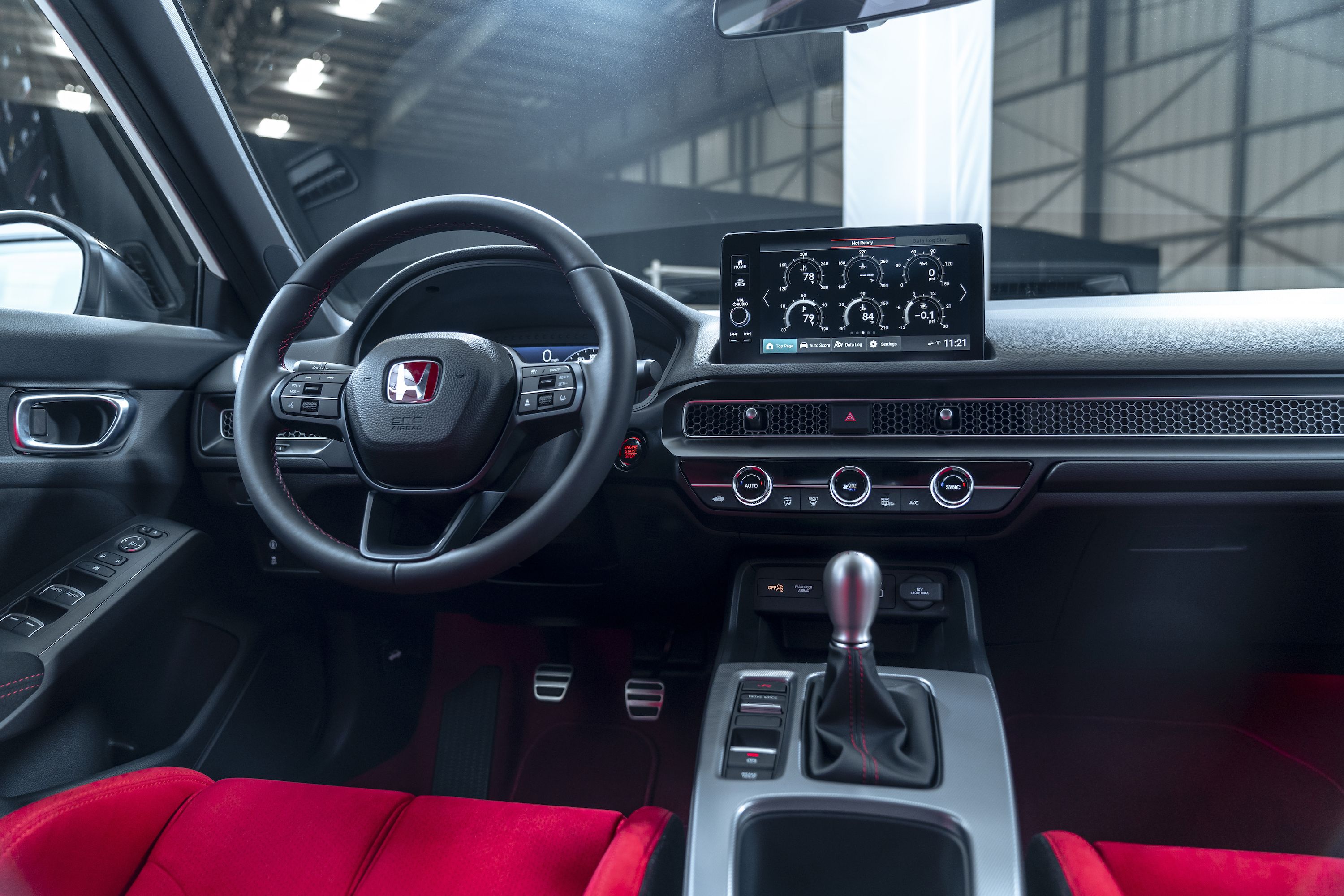 back seats of modern luxury car, red leather interior