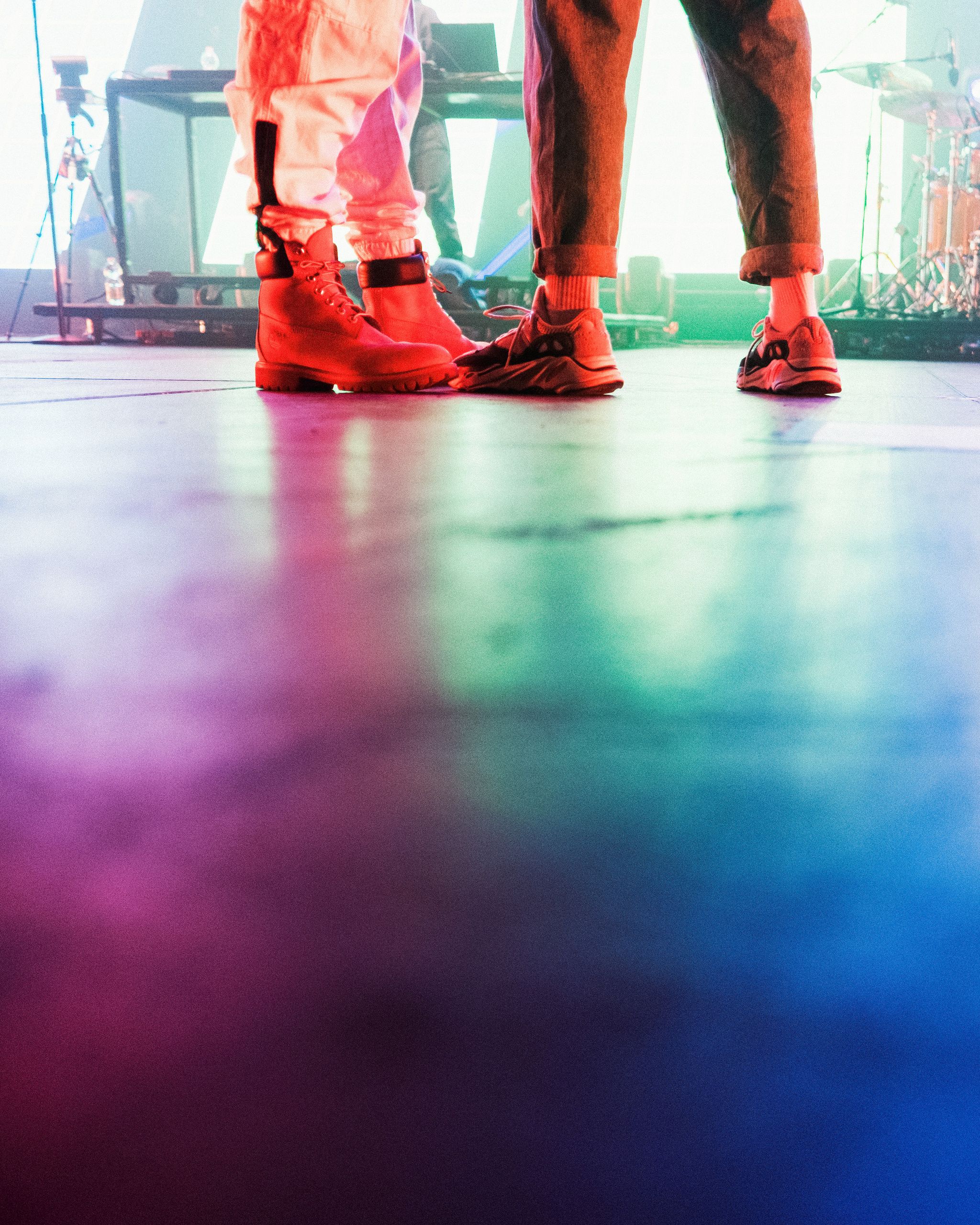 a pair of people wearing red shoes