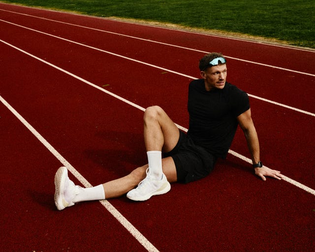 athlete resting on a running track