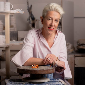 a person working in a pottery studio focusing on handmade decorations