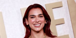 dua lipa at golden globes smiling at camera