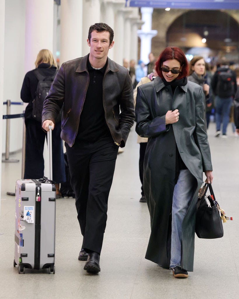 dua lipa and callum turner spotted in kings cross st pancreas station in london