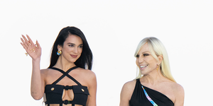 dua lipa and donatella versace at the fashion show of the duo's co designed collection