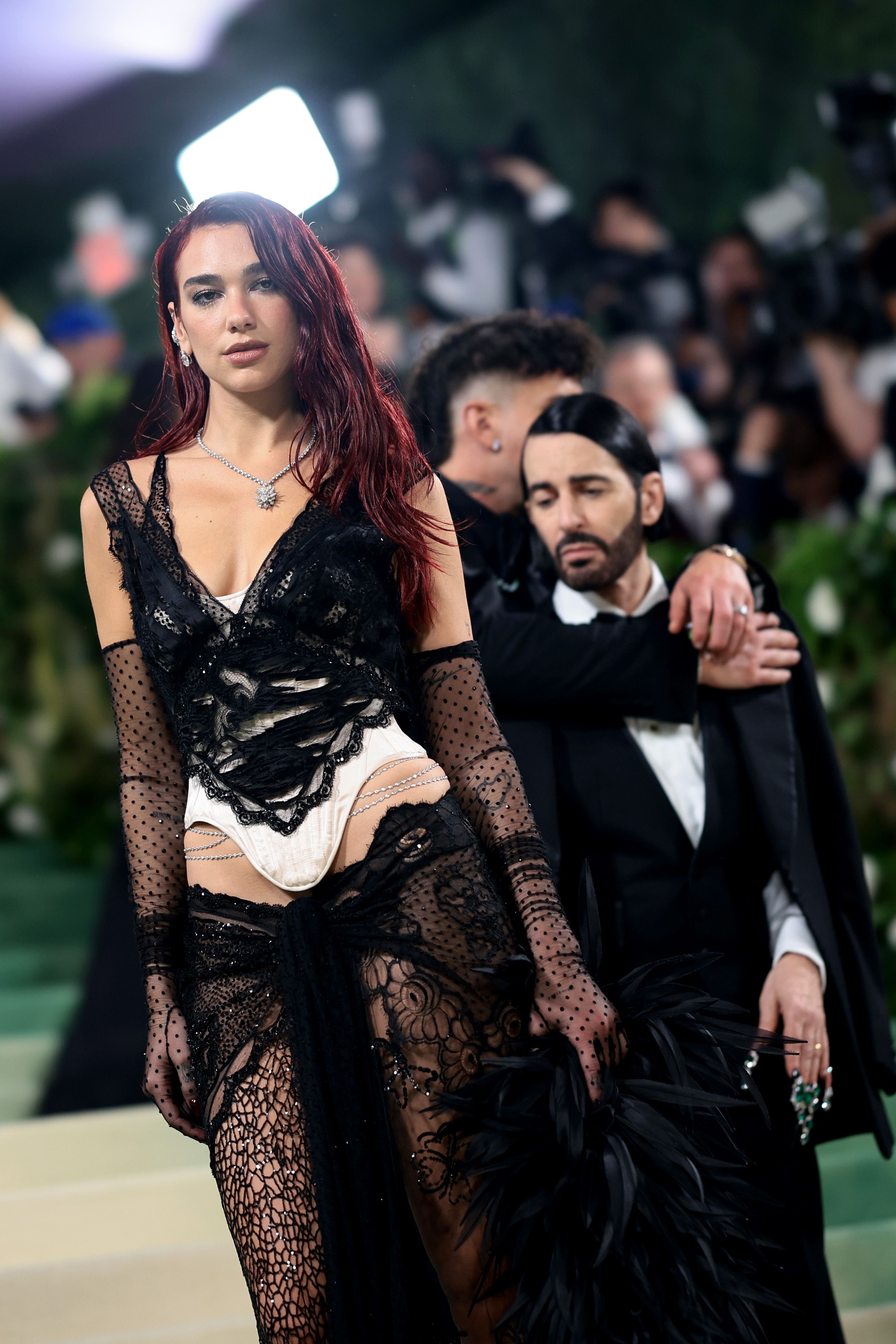 Dua Lipa Wears Feathers and Naked Lace at 2024 Met Gala