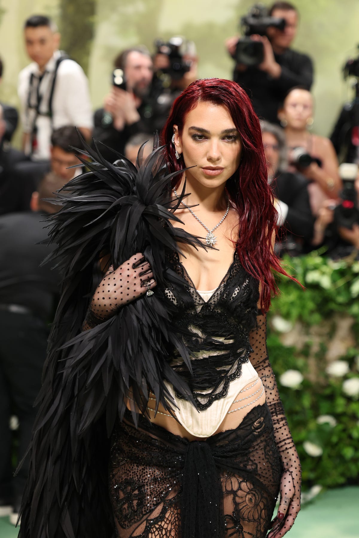 Dua Lipa Wears an All-Black Feathered Look to the 2024 Met Gala