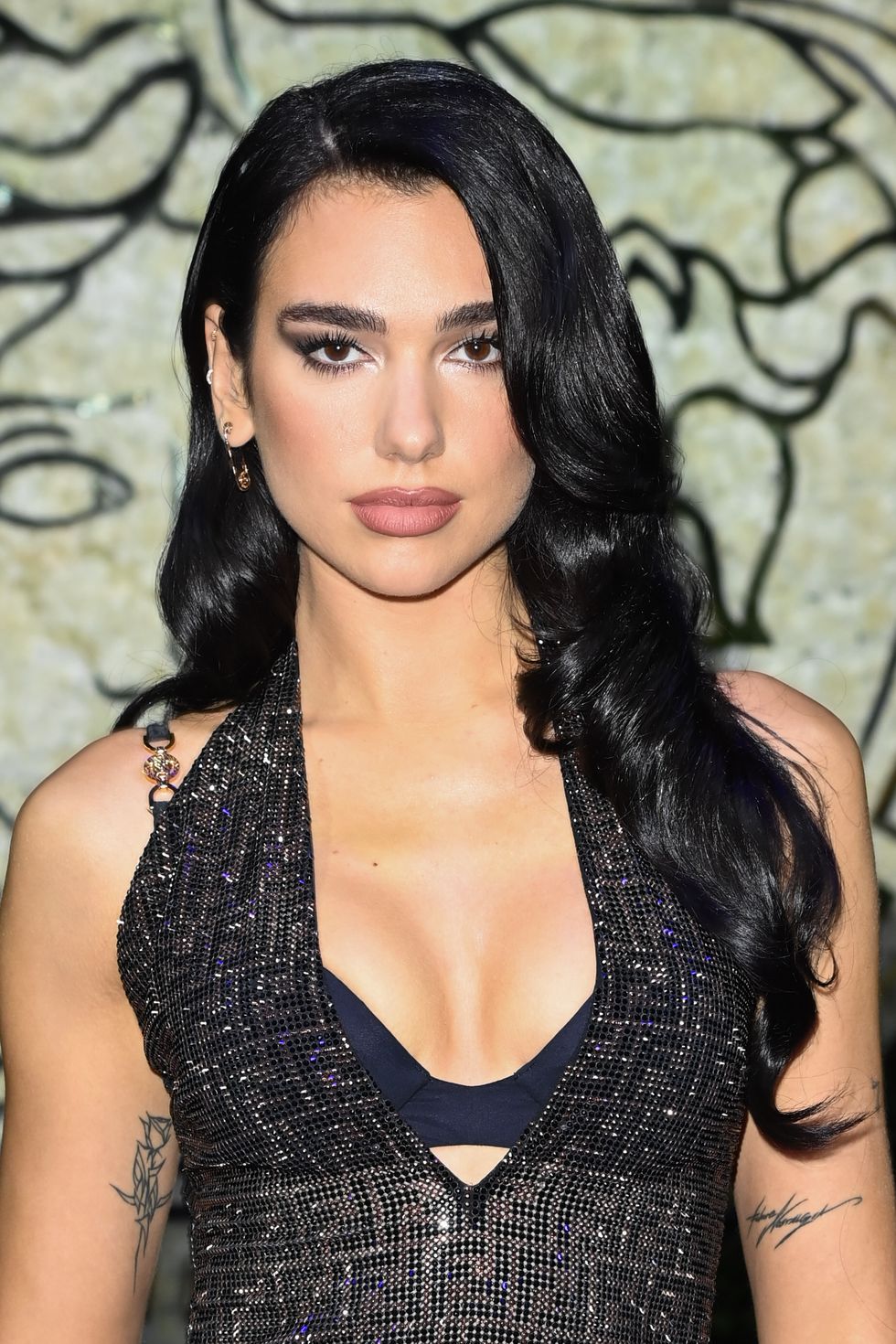 milan, italy   september 26 dua lipa is seen on the front row of the versace special event during the milan fashion week   spring  summer 2022 on september 26, 2021 in milan, italy photo by daniele venturellidaniele venturelli  getty images