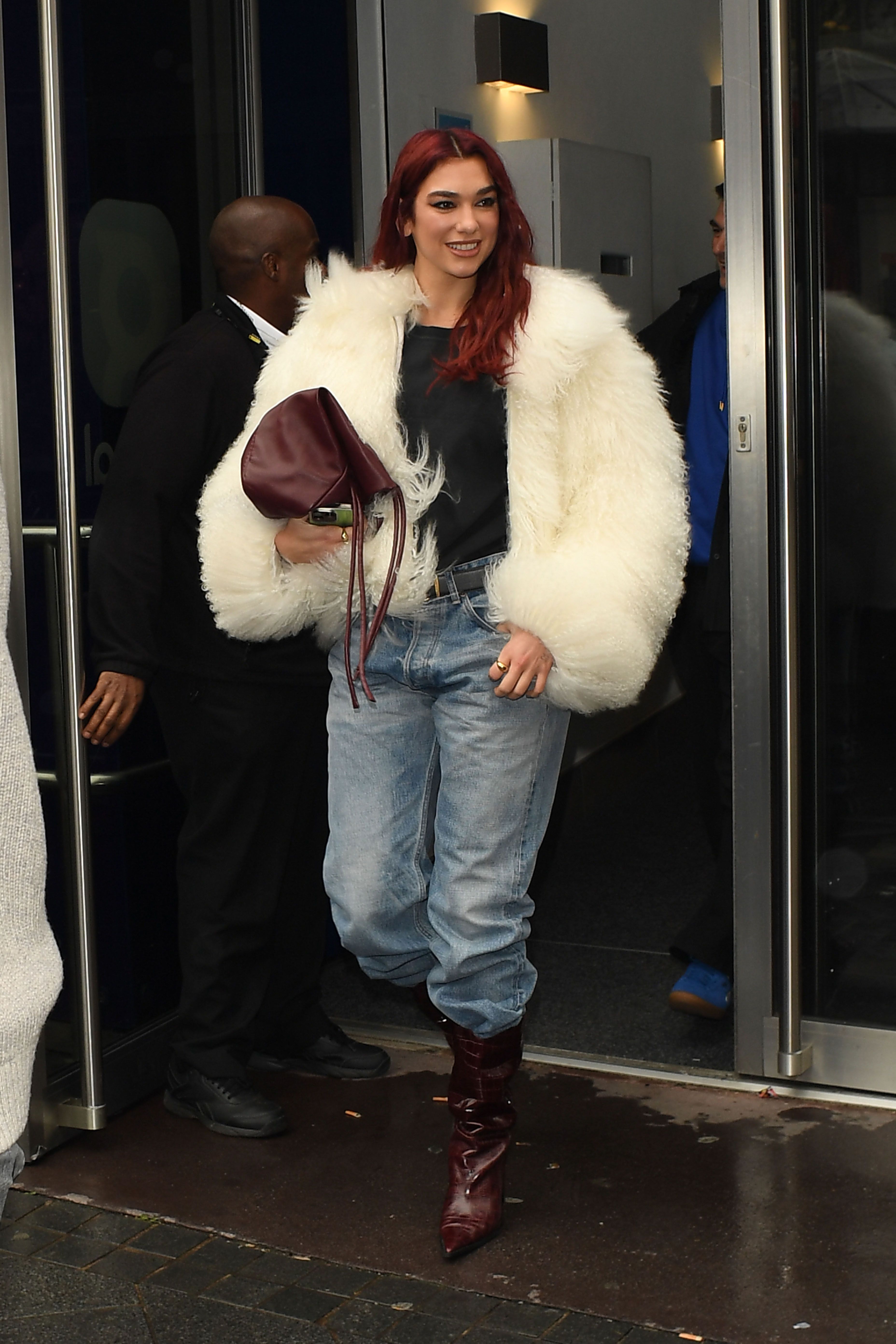 Dua Lipa Rewrites the Rules of Spring Dressing in a Fur Coat and Stockings