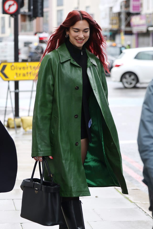 Dua Lipa makes the trouser-less trend work for a rainy day