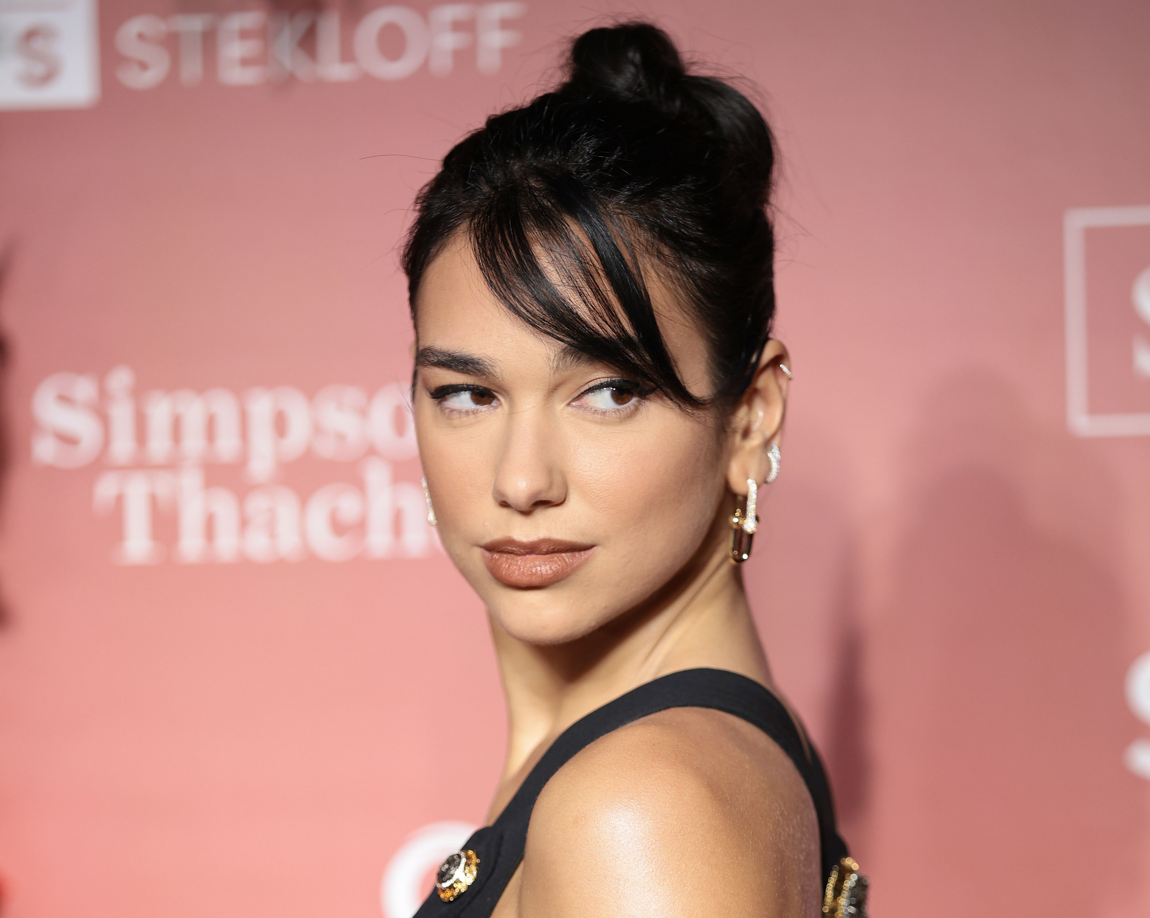 Dua Lipa's backless midi dress is giving major side boob