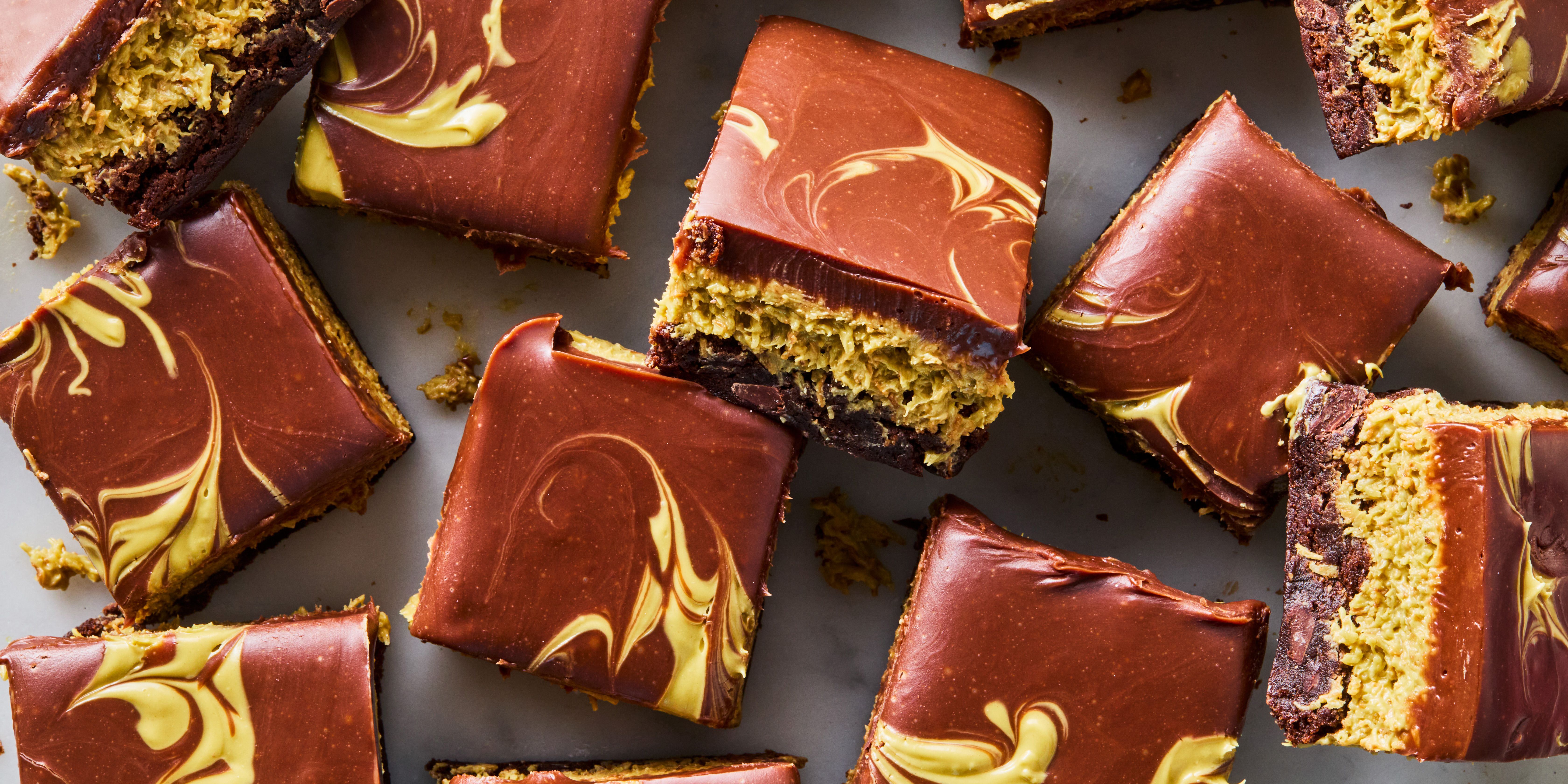 Rich chocolate brownies topped with Dubai chocolate-inspired ingredients including pistachios and tahini