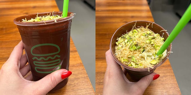 a chocolate dessert in a cup topped with vermicelli nuts and a green straw