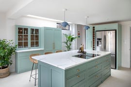 a kitchen with white cabinets