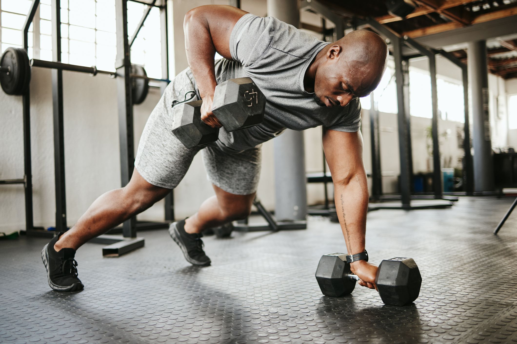 Free Weights vs. Machines: 8 Benefits, Form Tips, Weights, and More