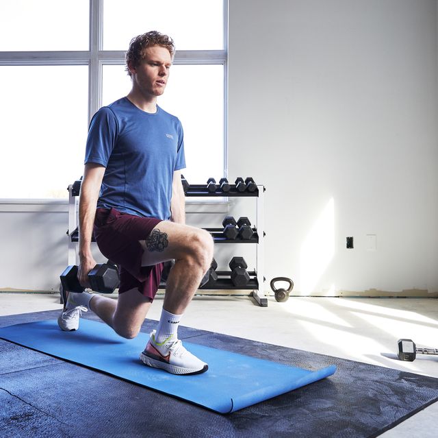 a man doing a lunge with dumbbells