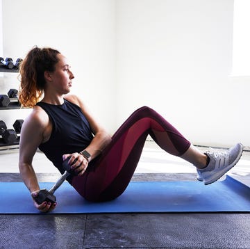 a person exercising on a mat