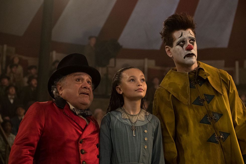 clowning around    in tim burton’s all new, live action reimagining of “dumbo,” circus owner max medici danny devito calls on former circus star holt farrier colin farrell to care for a newborn elephant whose oversized ears make him a laughingstock in an already struggling circus holt ultimately takes his task very seriously—even donning a clown suit to help the flying elephant as he emerges as a star daughter milly nico parker just might be dumbo’s biggest fan “dumbo” flies into theaters on march 29, 2019 photo by jay maidment © 2018 disney enterprises, inc all rights reserved