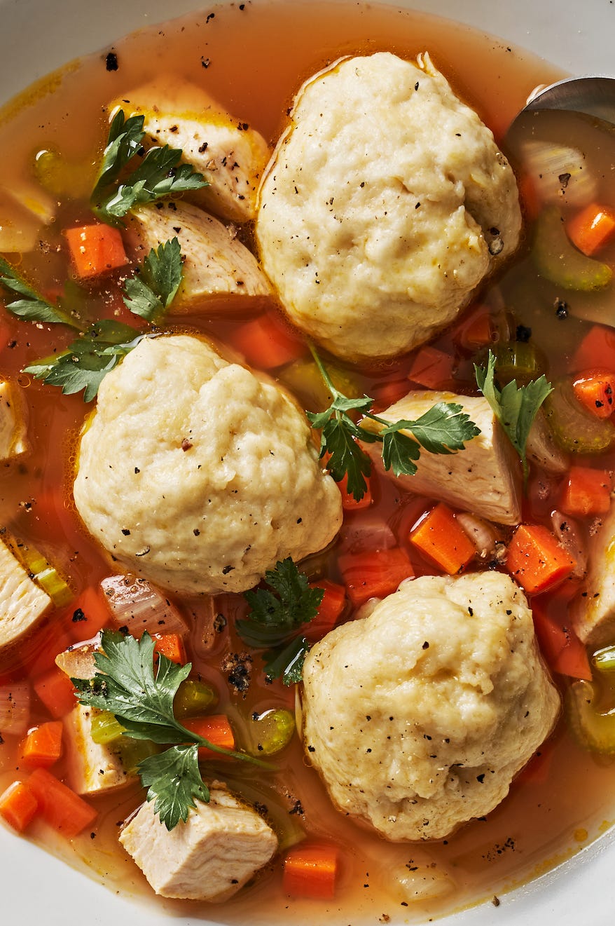 Dumplings and chicken soup dumplings in a chicken soup with carrots and veggies