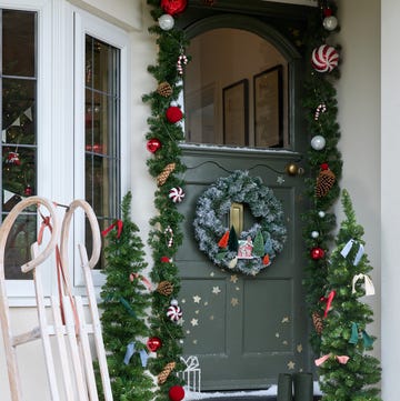Front door with wreath and festive decorations christmas front door porchscaping