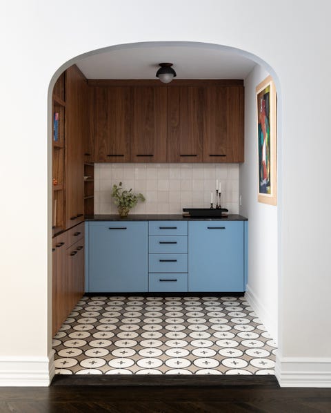 small kitchen with blue and wood cabinets