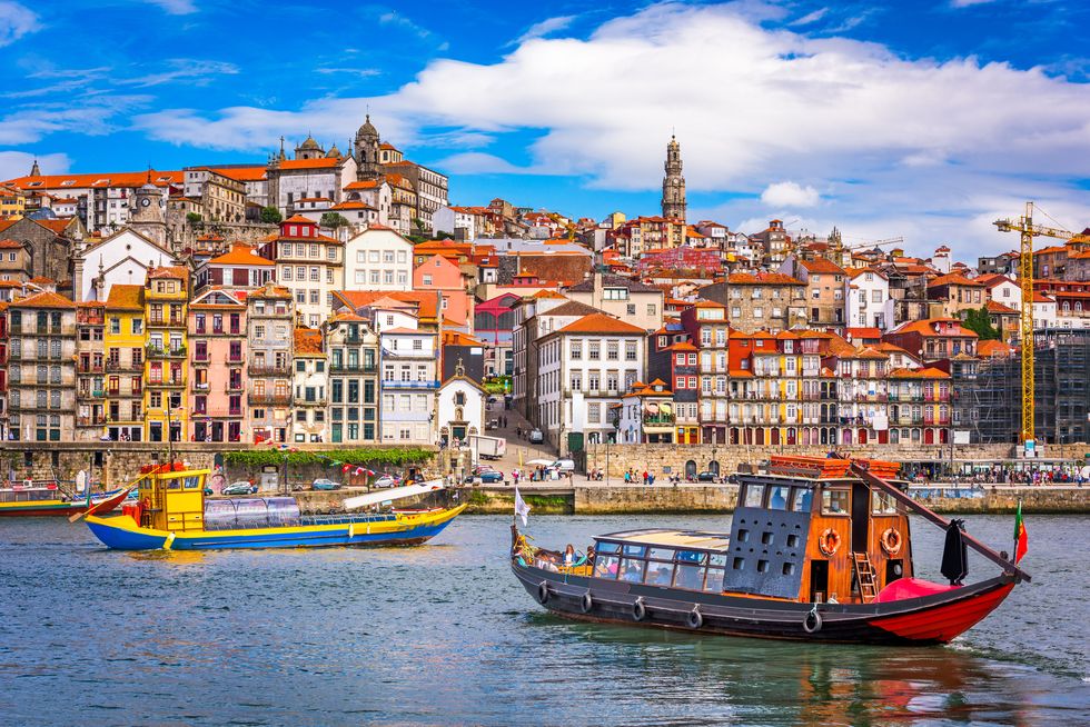 porto, portugal old town skyline from across the douro river