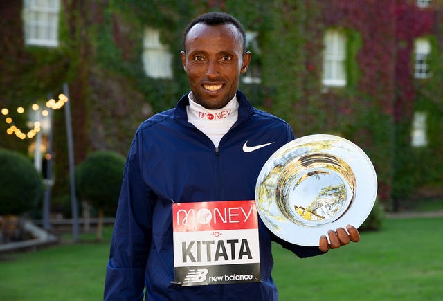 shura kitata eth, winner of the elite men’s race, poses with his winner’s trophy at the official hotel location not disclosed and biosecure bubble on the day following the historic elite only virgin money london marathon which took place on a closed loop circuit around st jamess park in central london on sunday 4 october 2020

photo dan vernon for virgin money london marathon, monday 5th october 2020

for further information medialondonmarathoneventscouk