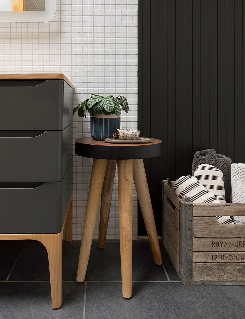 small stool with plant in bathroom