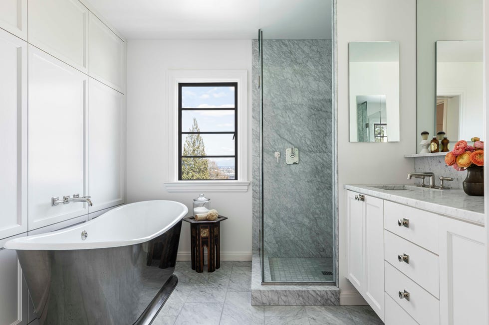 main bathroom, white cabinets, black and white bath tub, shower