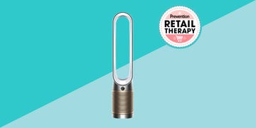 dyson air purifier in front of two blue triangles and a retail therapy prevention sticker