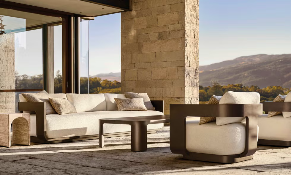 Outdoor seating area with modern furniture and scenic view.