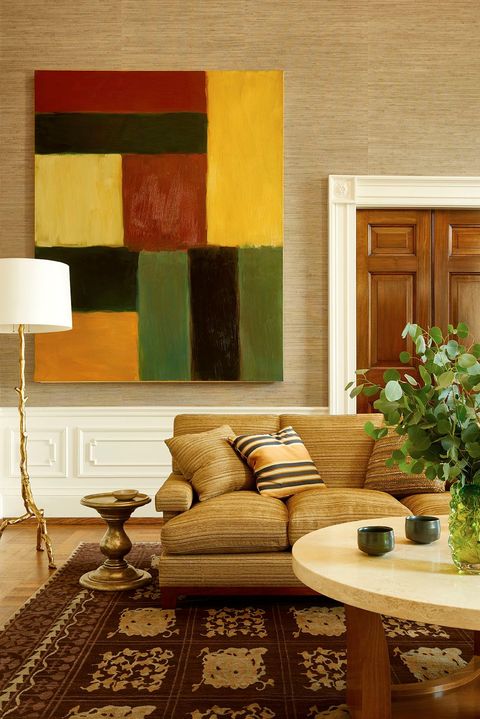 colorful art over beige sofa