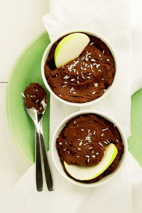 two ramekins of homemade chocolate dessert hummus with green apple slices, a healthy sweet snack