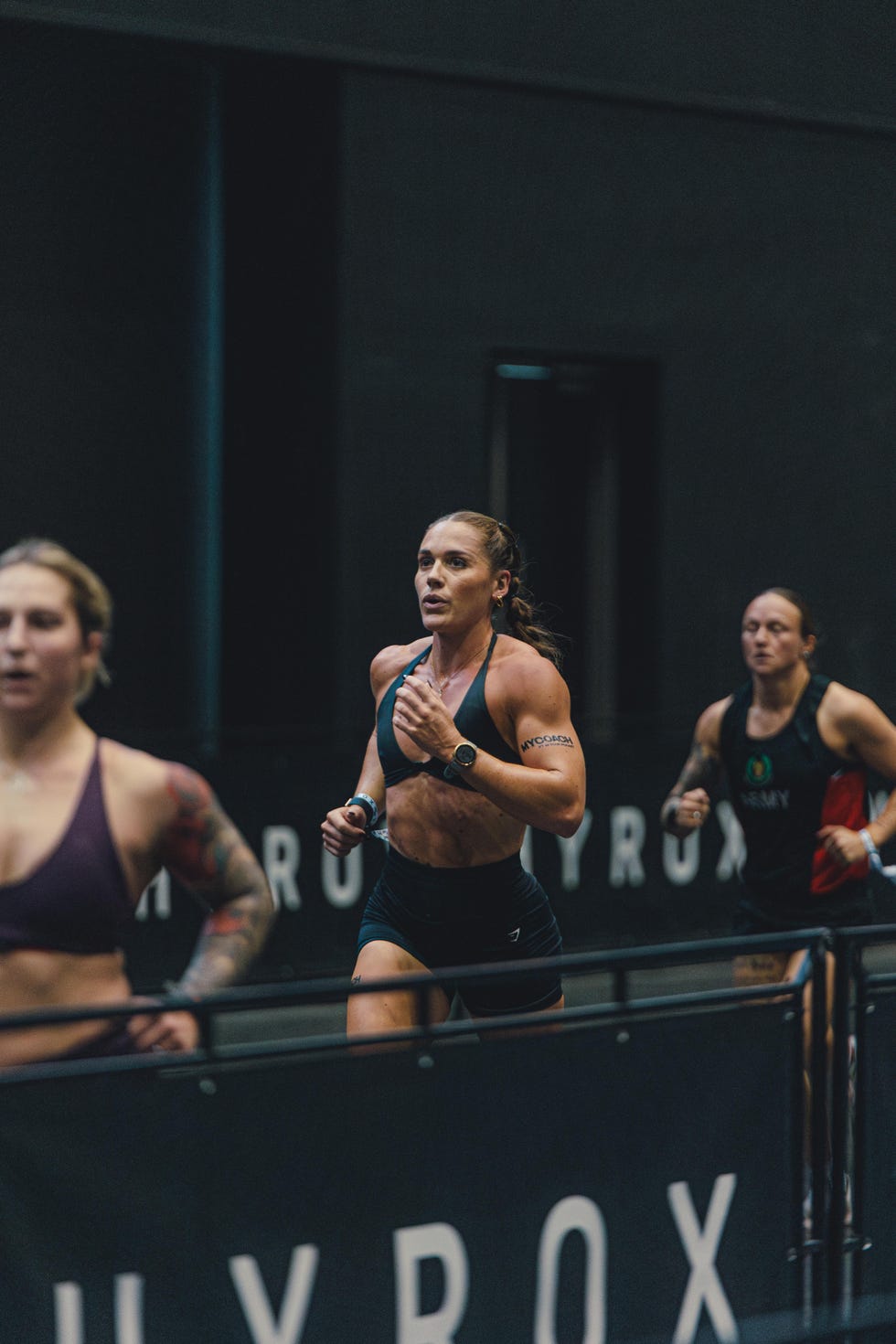 athletes running in a competitive event indoors