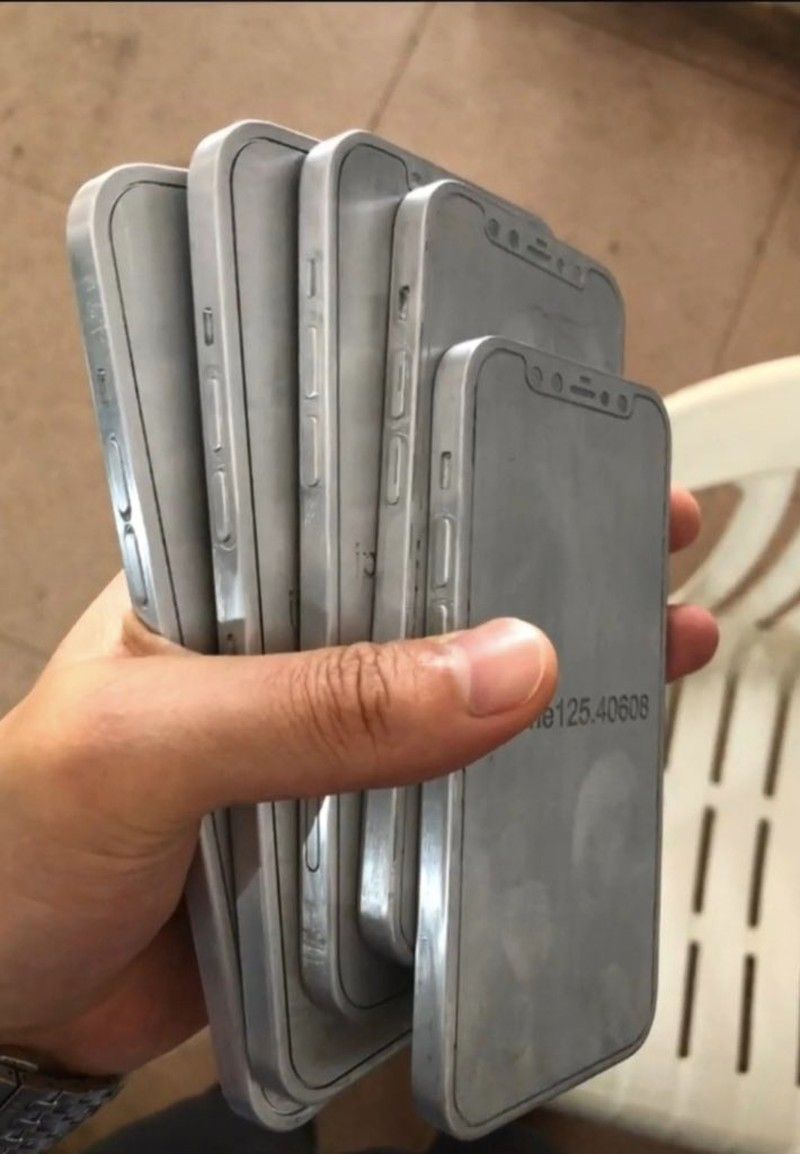 a person holds five iphone molds