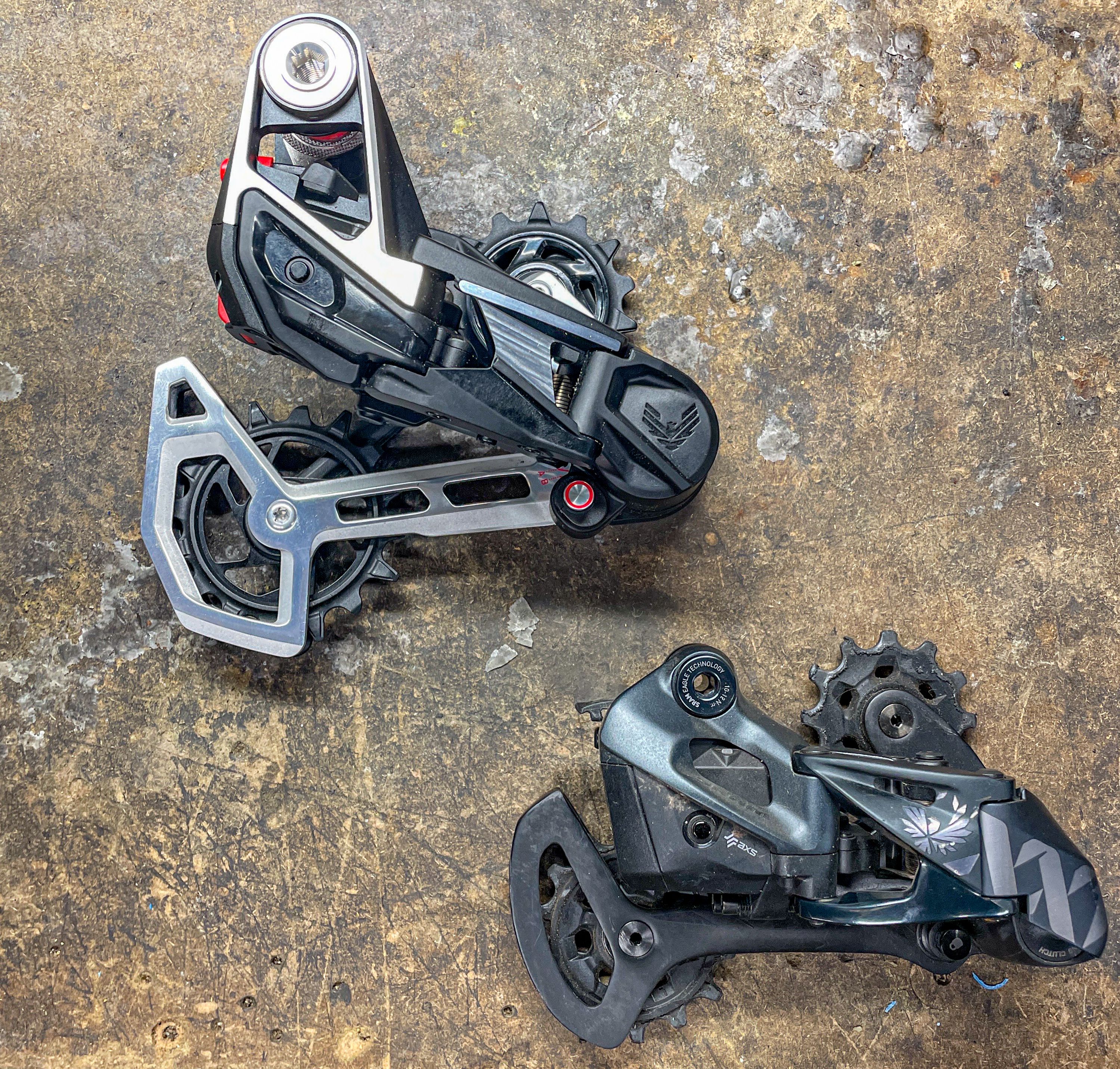 The T-Type derailleur (top) is noticeably larger and heavier than an Eagle AXS derailleur (bottom) 