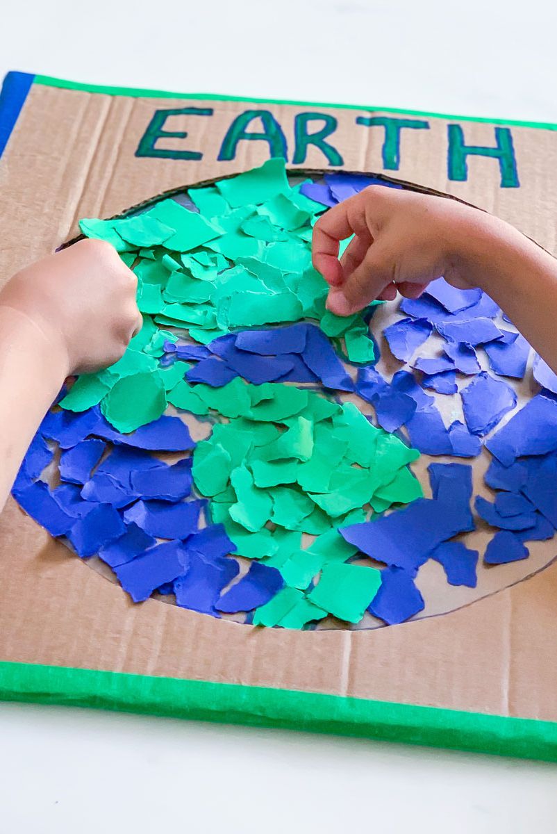 https://hips.hearstapps.com/hmg-prod/images/earth-day-craft-kids-cardboard-earth-collage-1648478409.jpeg?crop=0.668xw:1.00xh;0.180xw,0&resize=980:*