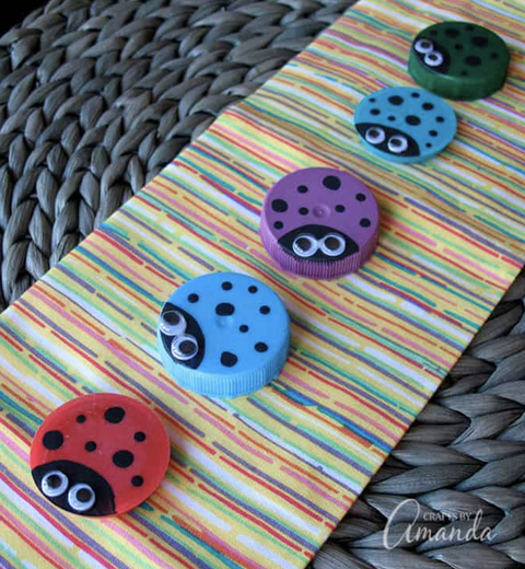earth day crafts, colorful ladybugs made of plastic lids