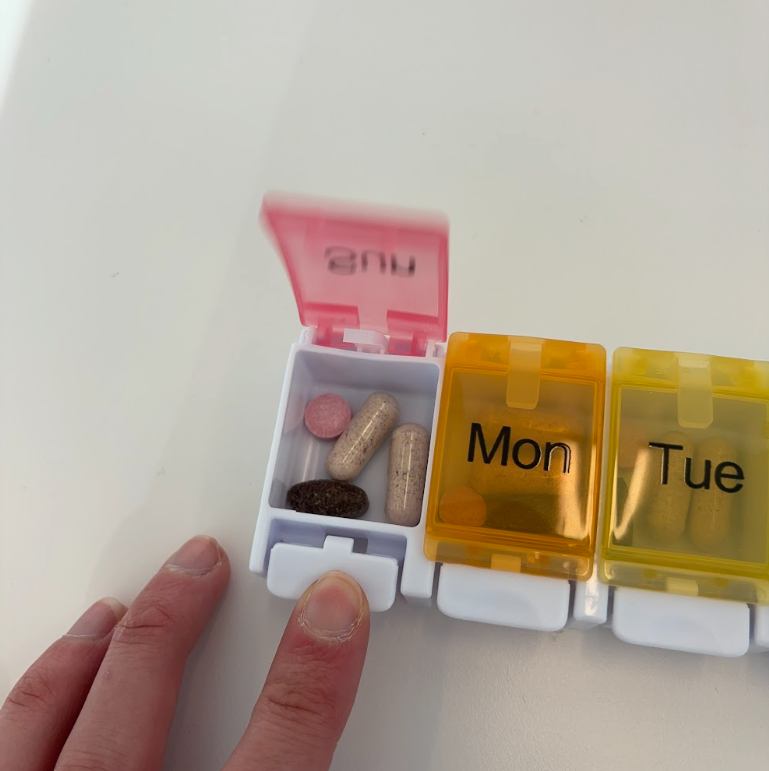 Opening a pill organizer opening a pill organizer