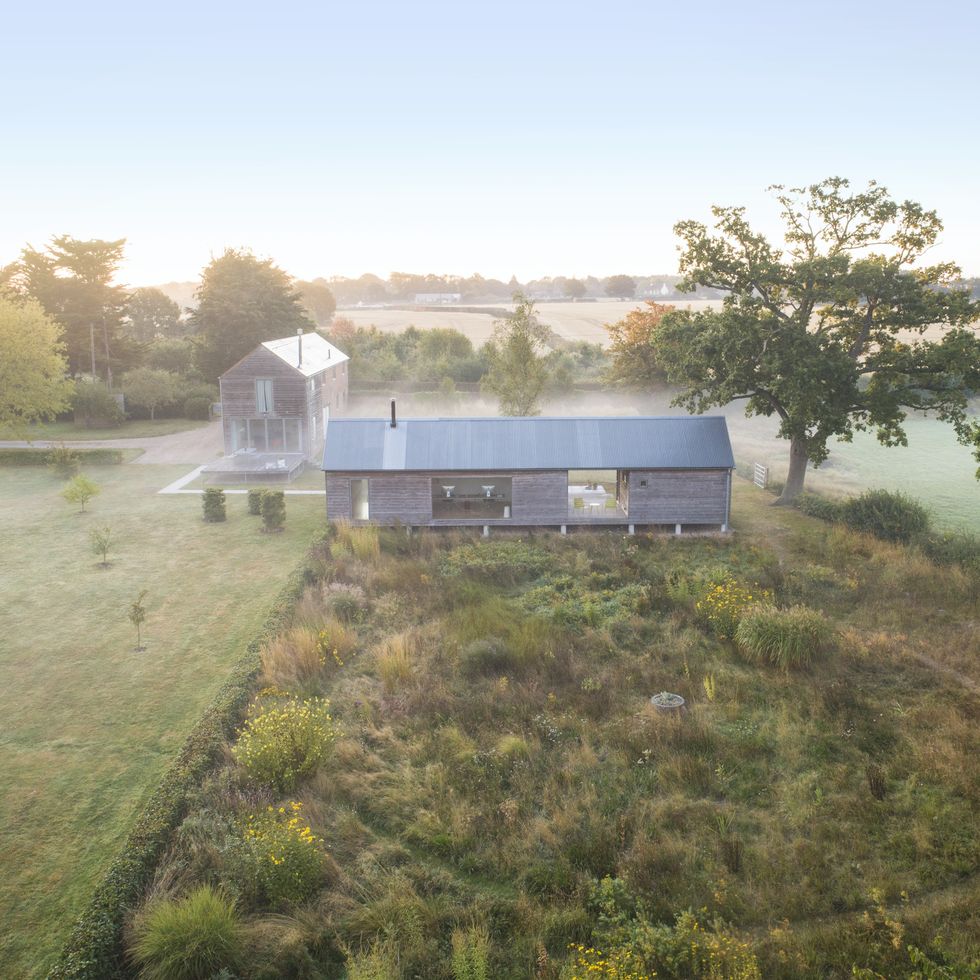 home in east sussex, england design by emma burrill a circular mowed path introduces a modern element