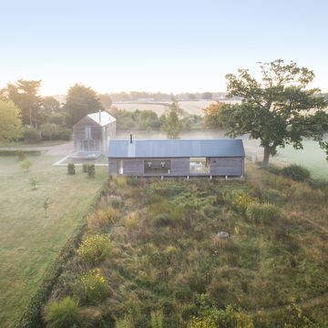 home in east sussex, england design by emma burrill a circular mowed path introduces a modern element