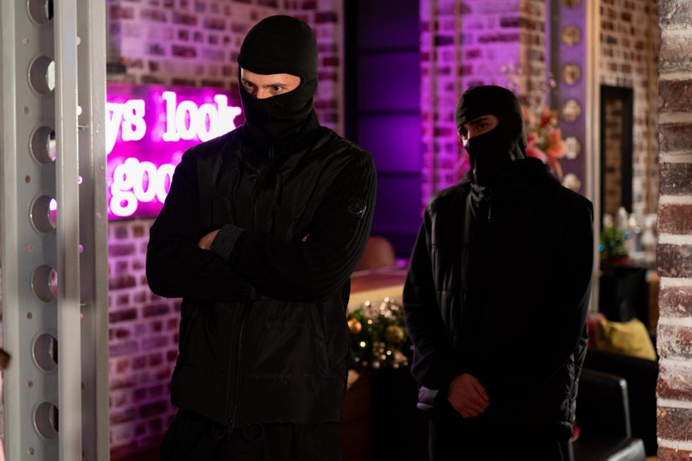 two people wearing balaclavas on eastenders