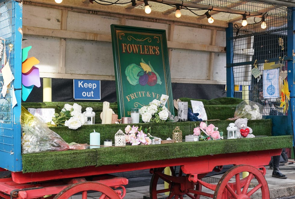 tributes on martin fowler's market stall in eastenders