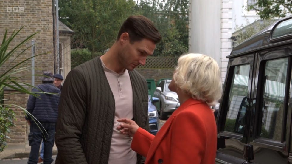 eastenders, outside, zack hudson talks to nicola mitchell in her big red coat