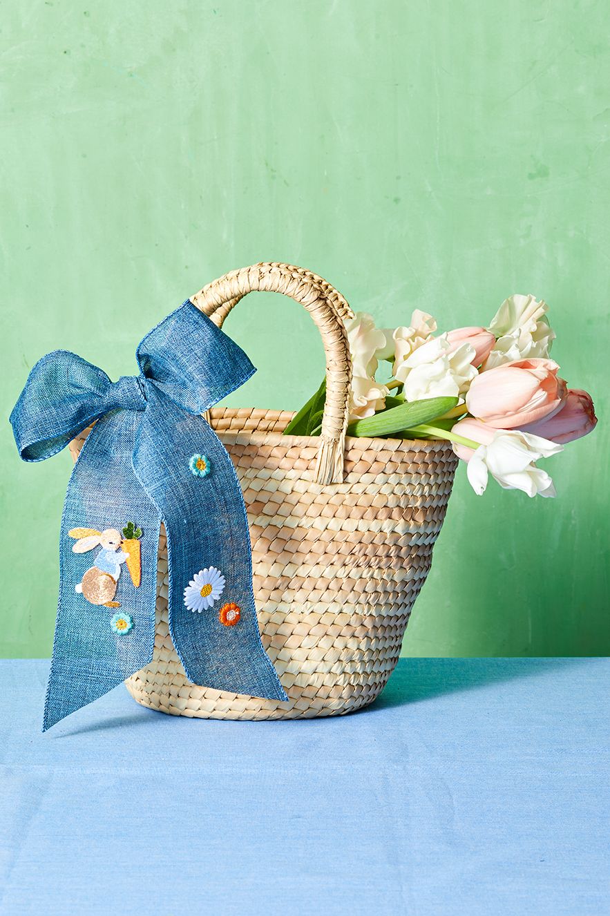 easter basket ideas embellished blue bow attached to a plain woven basket