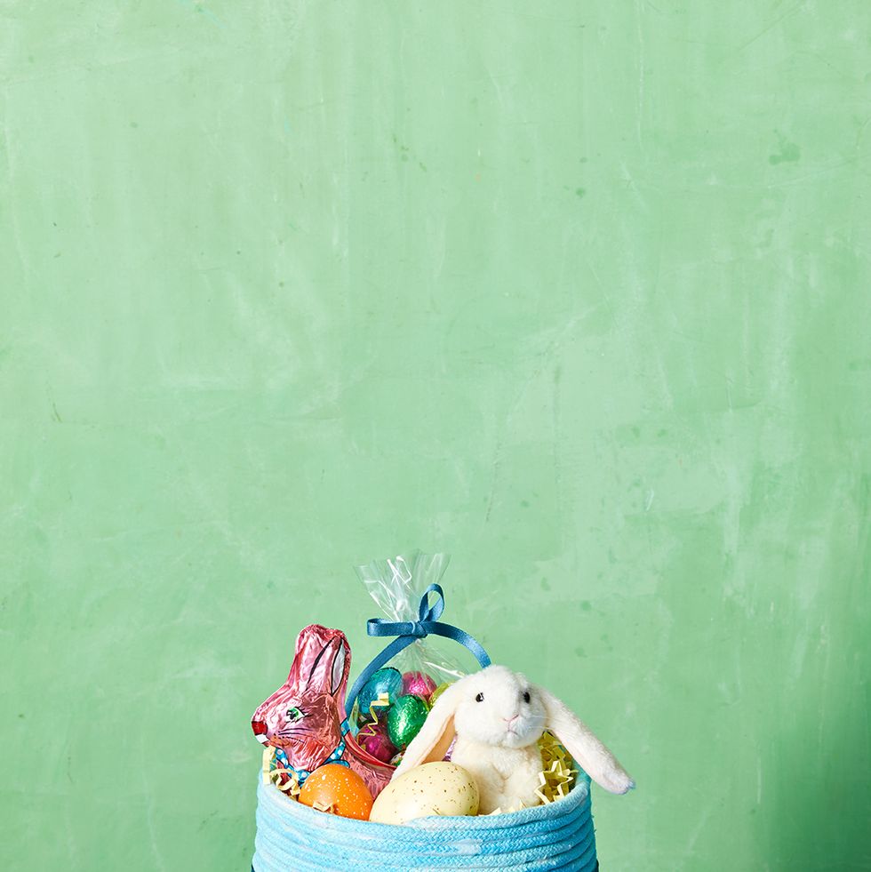 easter basket ideas, blue basket decorated with blue rope and a blue ribbon
