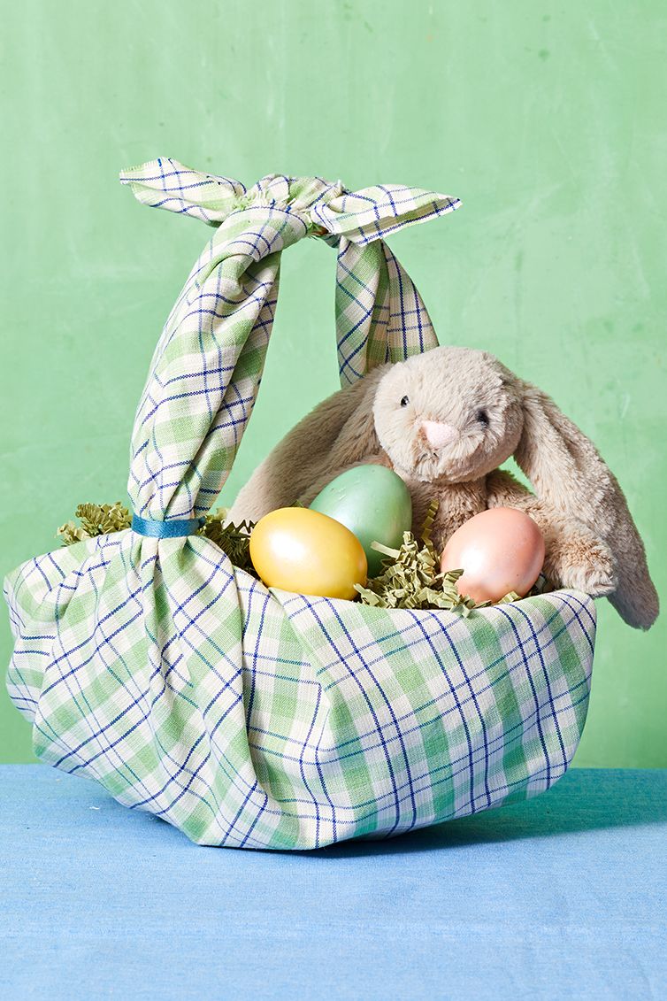 easter basket ideas, basket wrapped in patterned fabric, with a teddy bunny and eggs inside